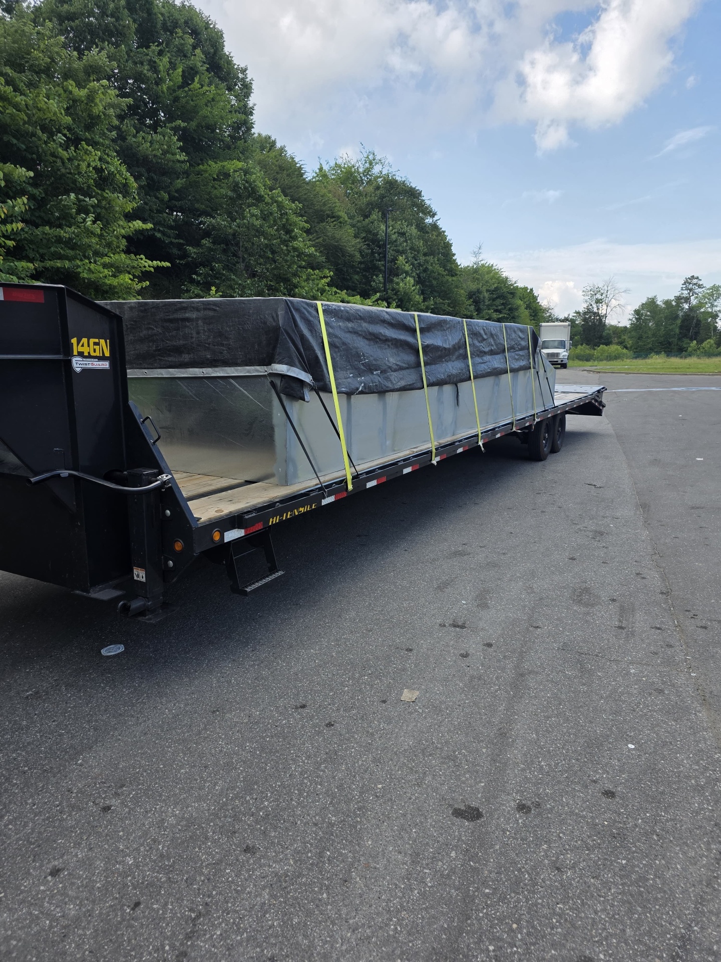 Loaded gooseneck flatbed trailer